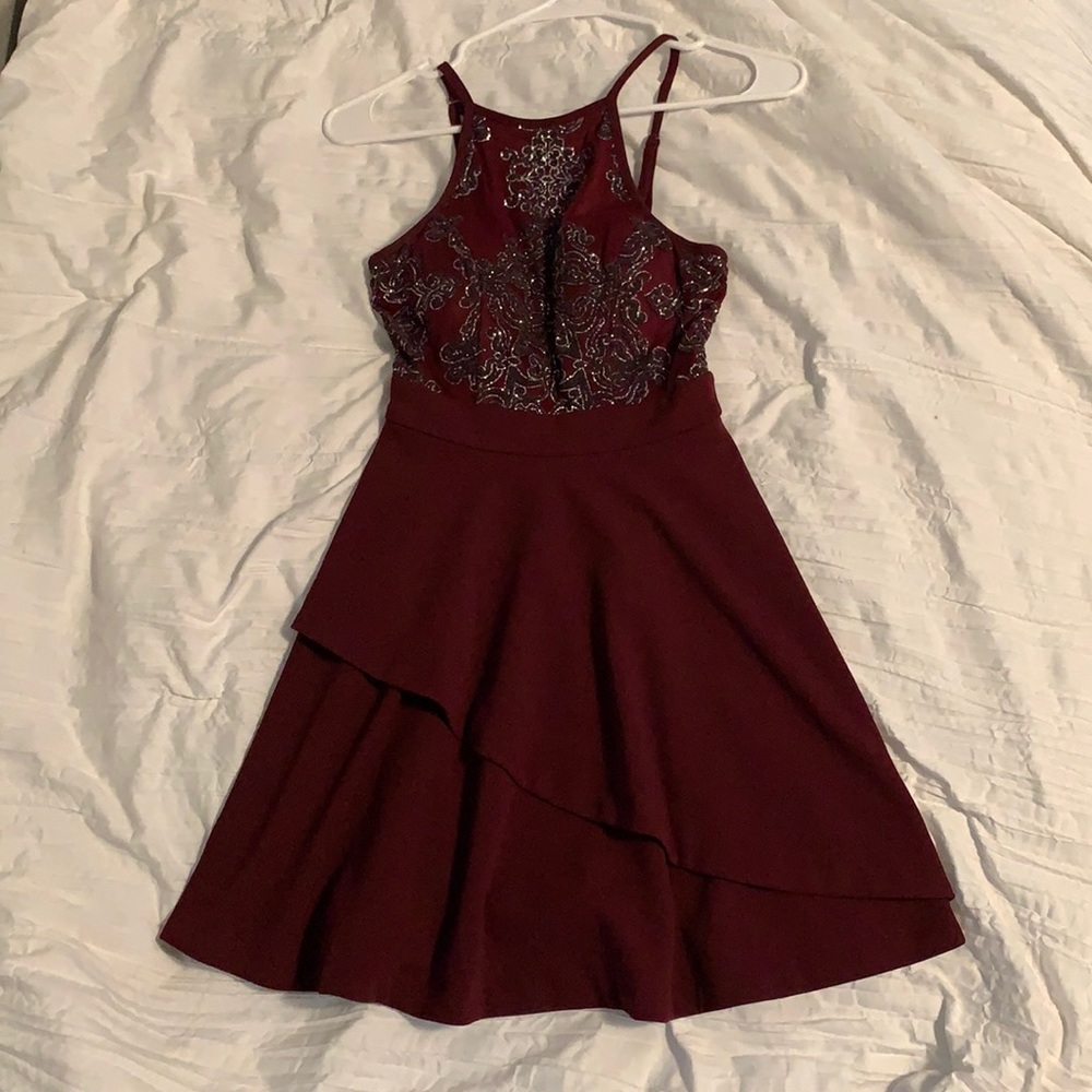 Burgundy halter dress with sparkly accents.